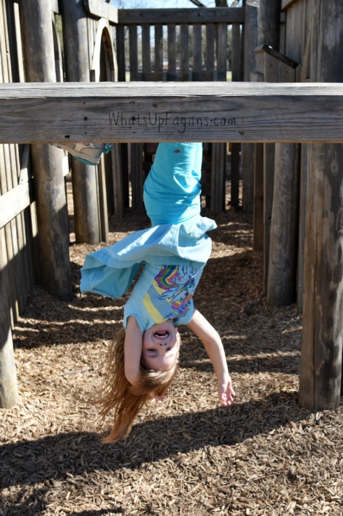 Hanging upside down at the playground