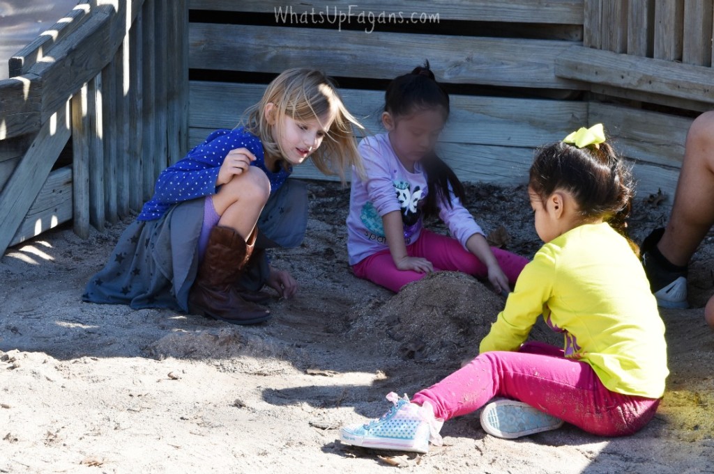 playing in the sand at the park